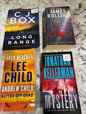 4 Assorted Paperback Thriller Books - Black, Red, Yellow, Blue
